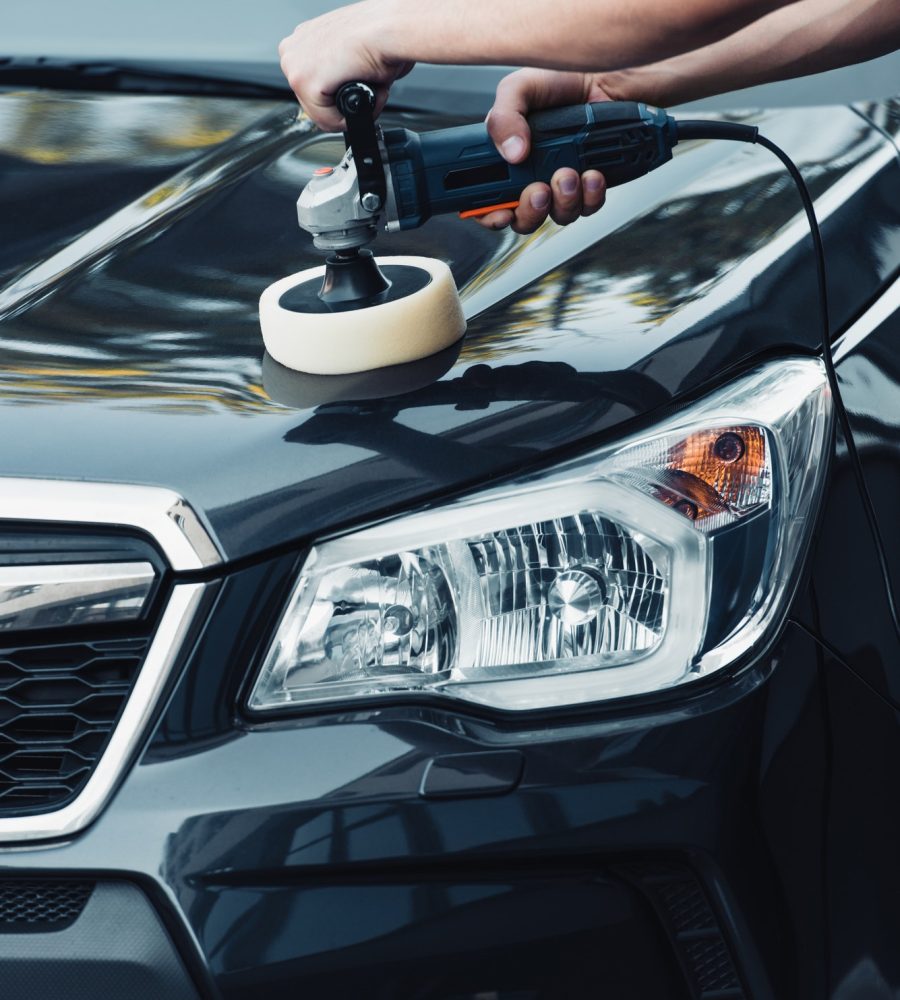 cropped-view-of-car-cleaner-polishing-car-with-polish-machine.jpg