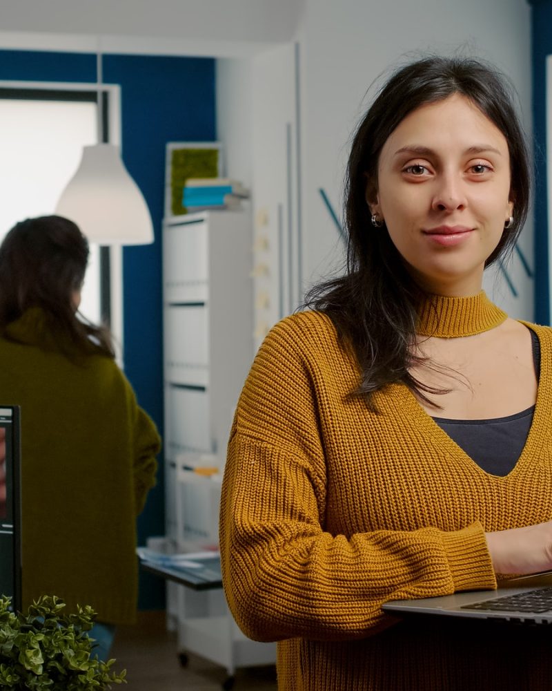 woman-retoucher-looking-at-camera-smiling-working-in-creative-media-agency.jpg